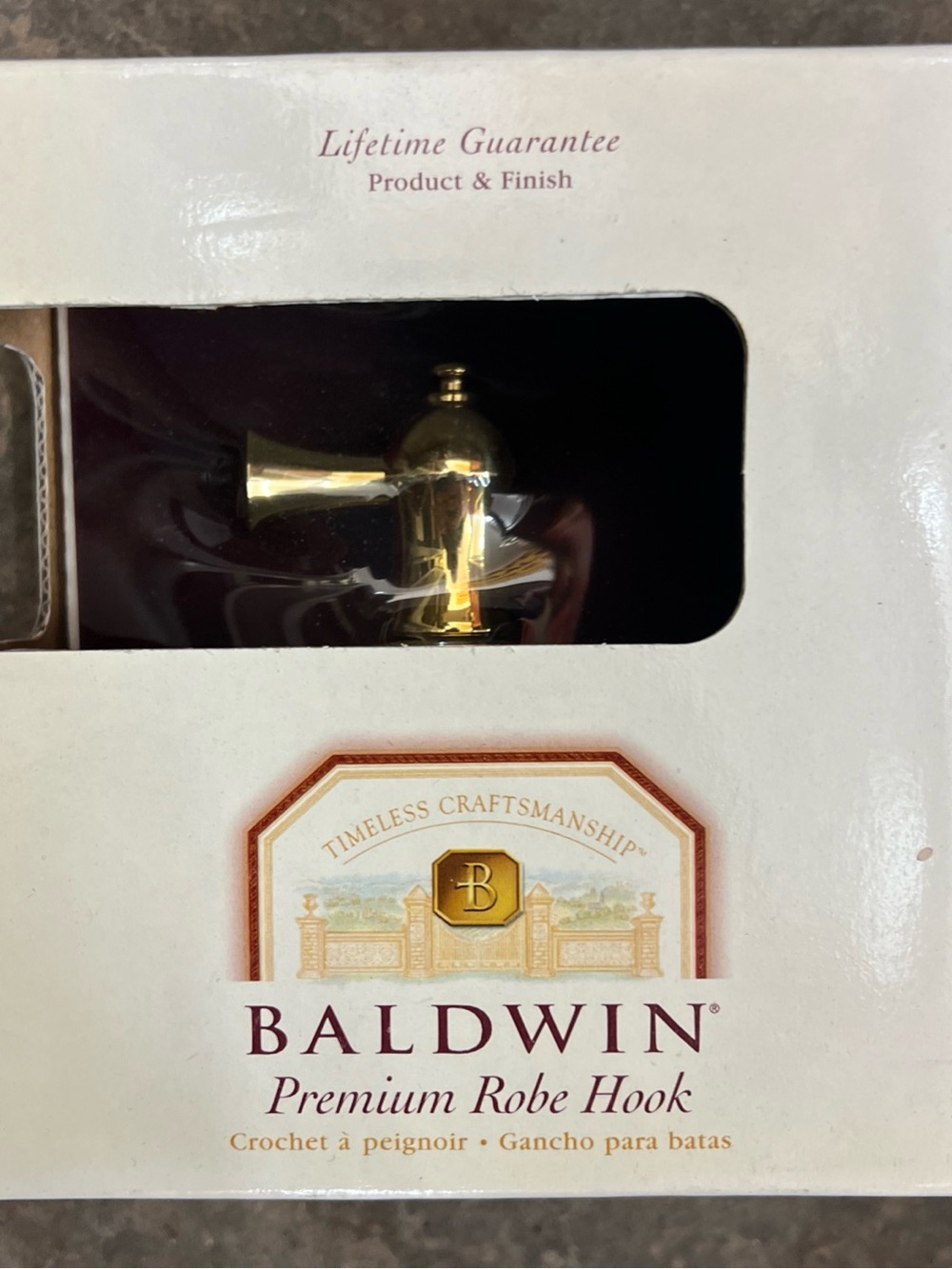 Baldwin Brass Hardware Packaging with Gold and Burgundy Accents